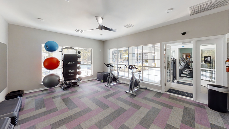24-Hour Fitness Center with stationary bikes and other exercise equipment